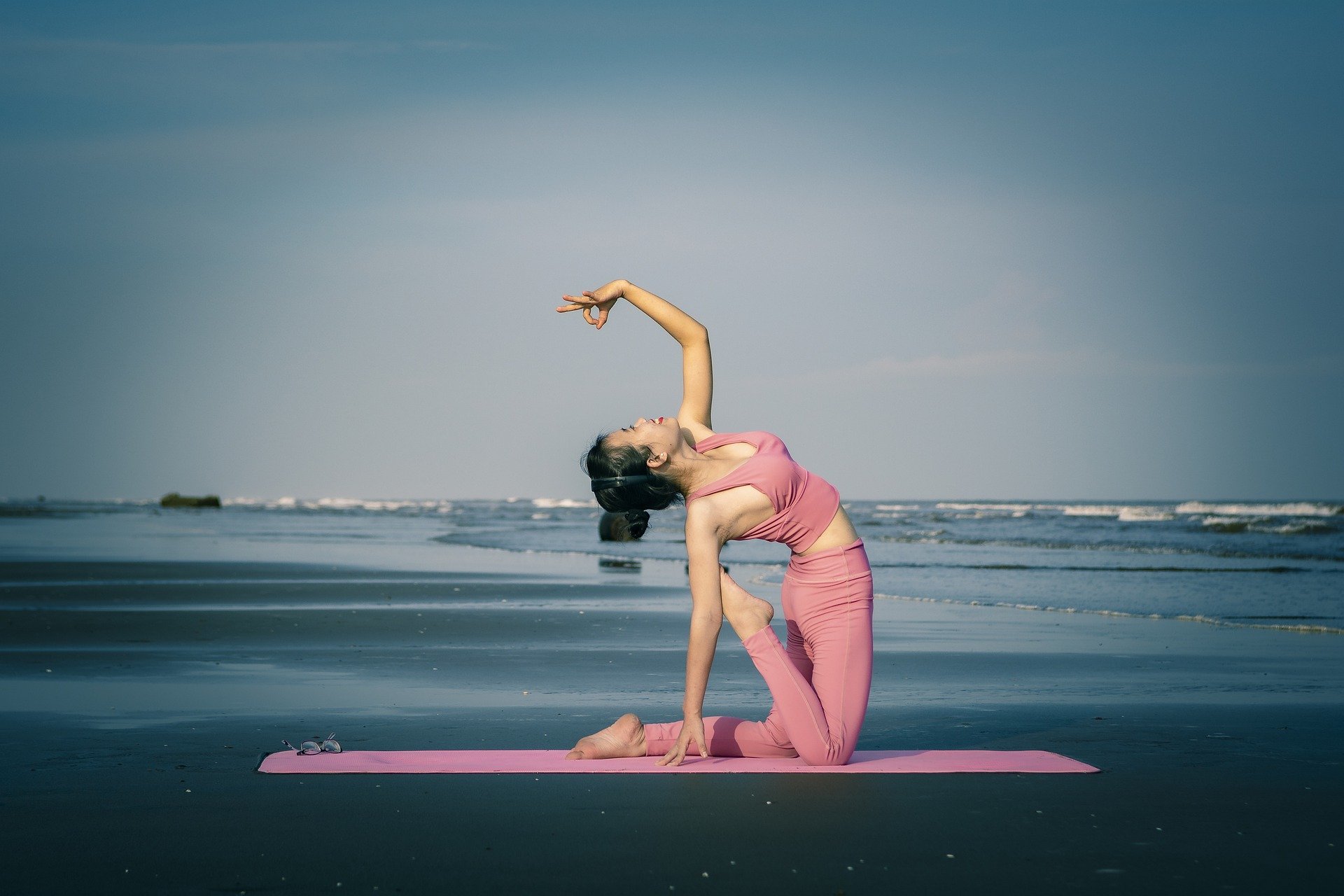 Girl doing Yoga on Beach Image